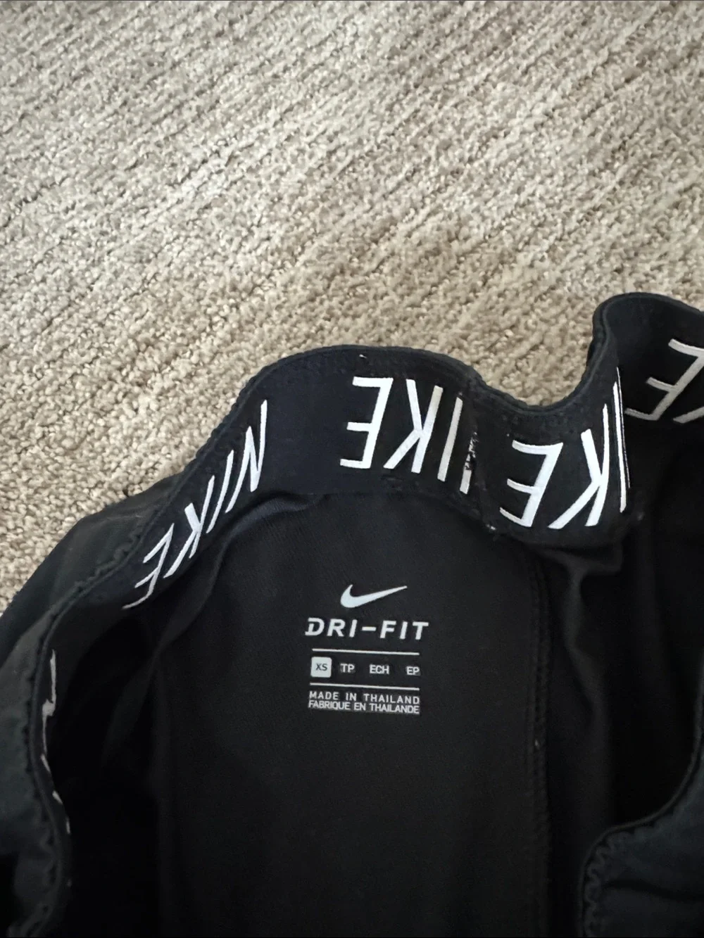Nike Black Women's Athletic Shorts with White Swoosh and Branded Waistband